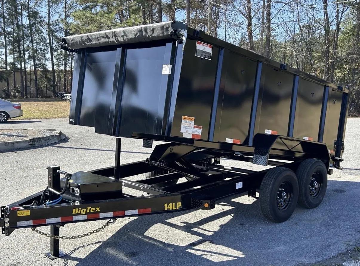 7x16 dump trailer with the bed raised to unload